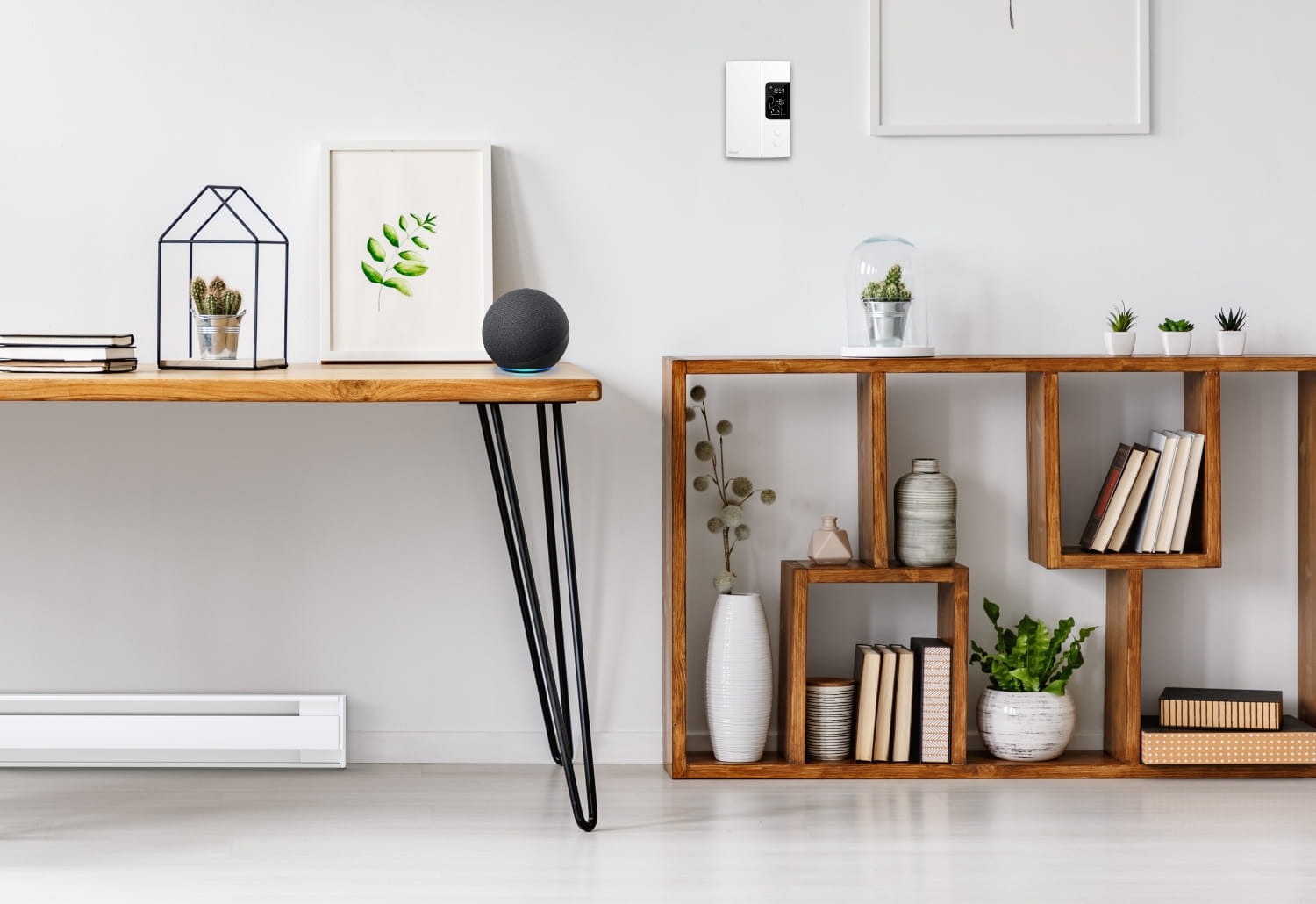 Electric baseboard thermostat installed on the wall in a room